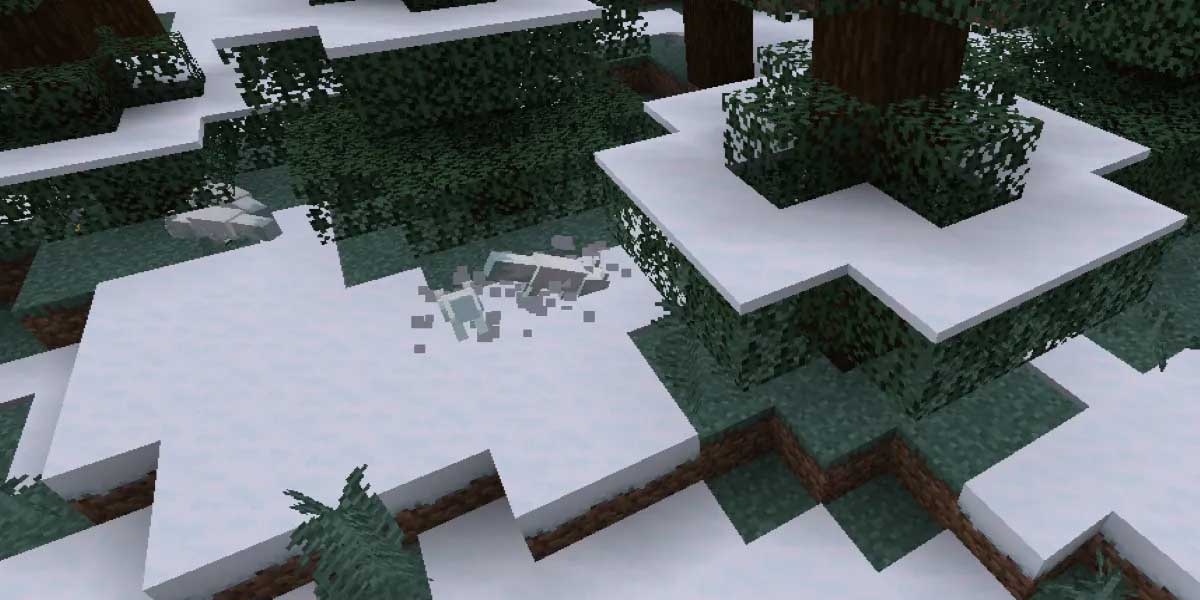 キツネが雪に埋もれているマインクラフトのゲーム内画面