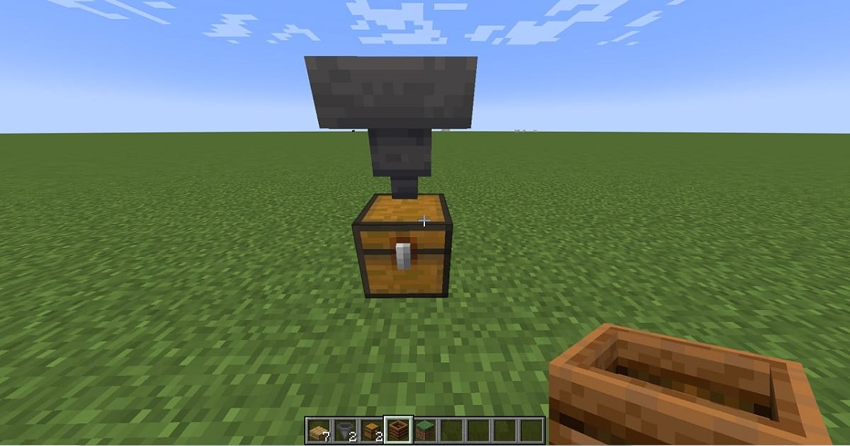 マイクラ骨粉製造機手順2チェストの上にホッパーを設置するゲーム内画面