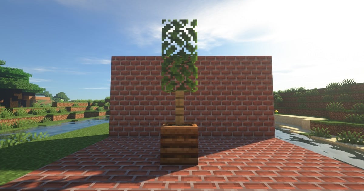 マイクラコンポスターとフェンスに葉を設置した背の高い観葉植物のゲーム内画面